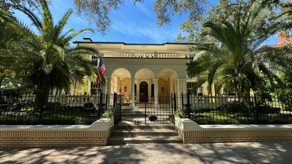 a beautiful home surrounded by palm trees