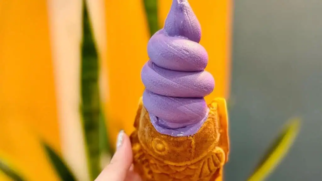 ube soft serve ice cream in a cone shaped like a fish 