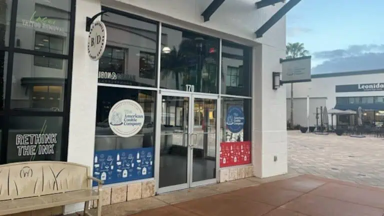 exterior of a bakery with cookie signage on the windows