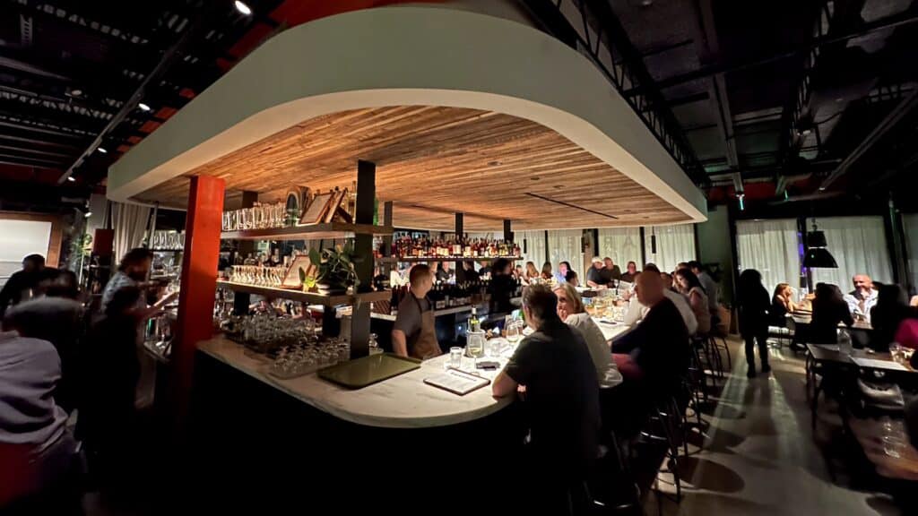 interior of a restaurant with a large oval-shaped bar