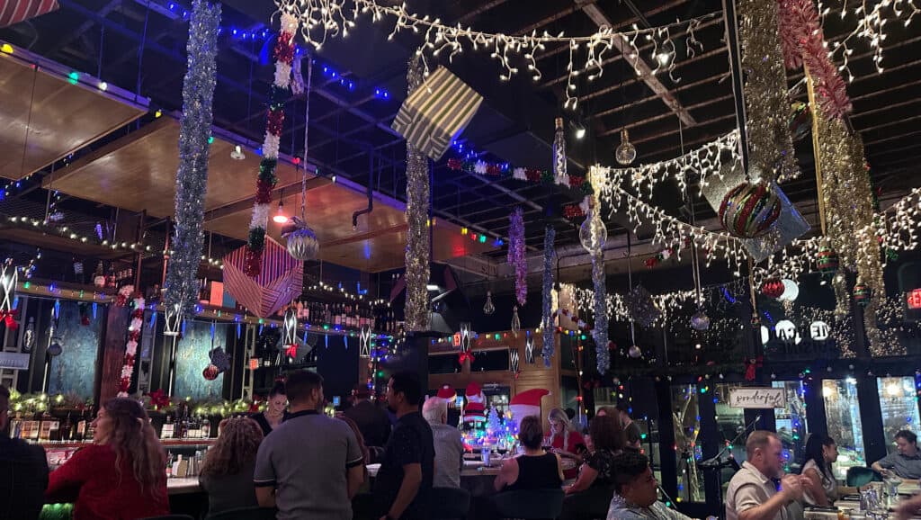 interior of a bar covered in Christmas decor 