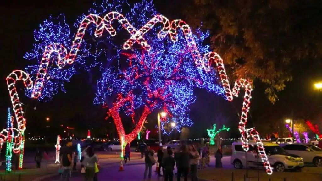 a large holiday lights display at a par