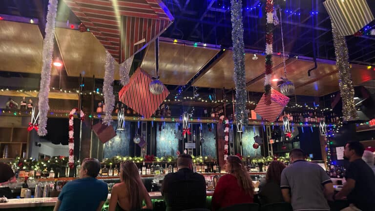 interior of a Christmas bar with gift boxes hanging from the ceiling