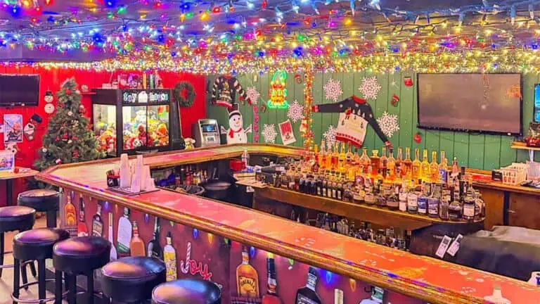 interior of a Christmas-themed bar with multiple string lights