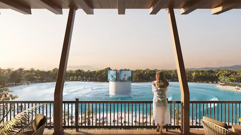 rendering of a surf park with someone watching the sunset from a private balcony