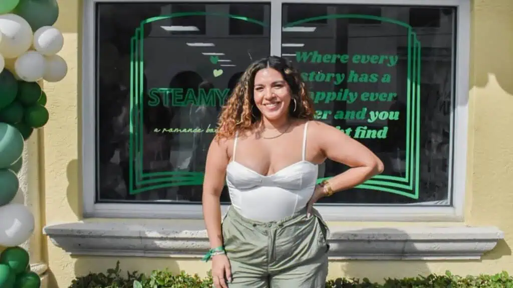 A peron stands in front of a bookstore 