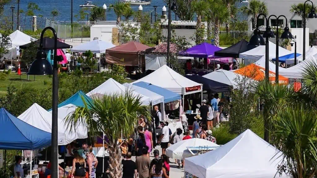 multiple vendors set up outside during a market on the waterfront