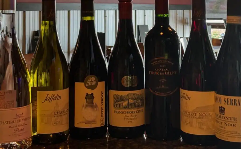 array of wine bottles on a table