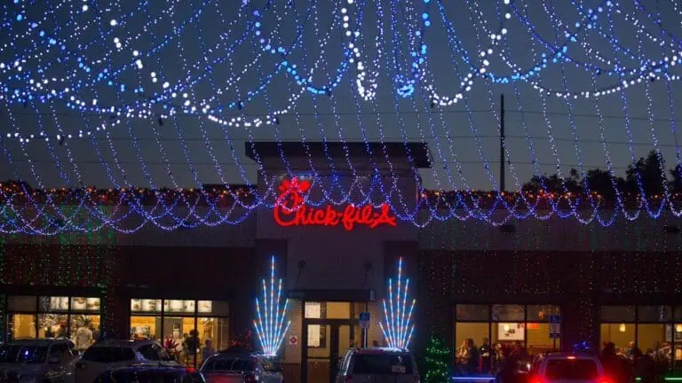 exterior of a Chick Fil A restaurant with Christmas lights out front