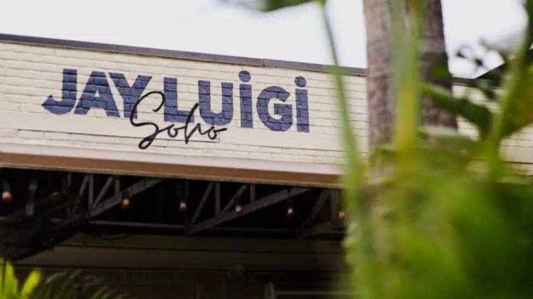 exterior of a restaurant with big black lettering on the front awning reading "Jay Luigi"