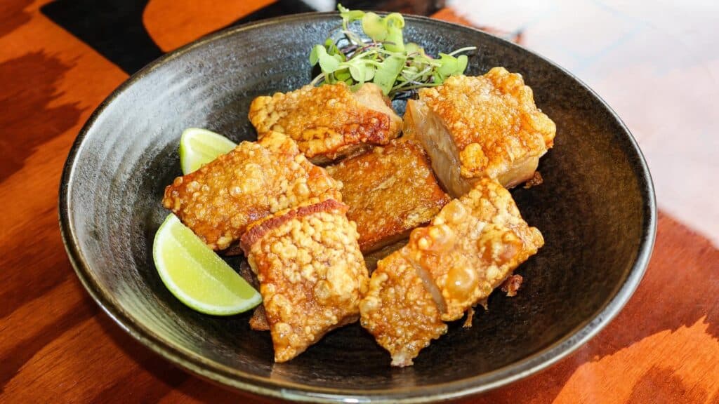 a plate of crispy pork belly 