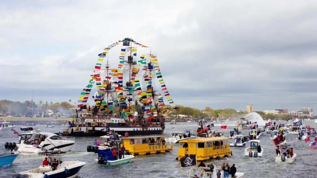 yellow water taxis in a large boat parade