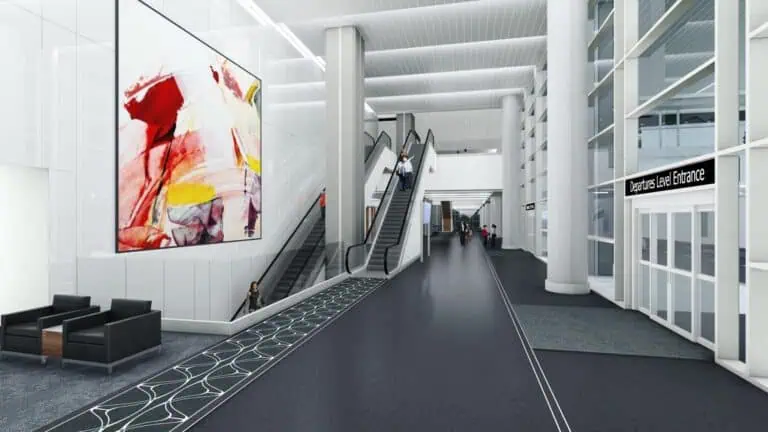 rendering of an airport pickup/dropoff location for passengers. Two escalators are visible