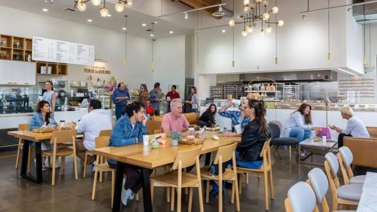 interior of a bakery with people enjoying pastries