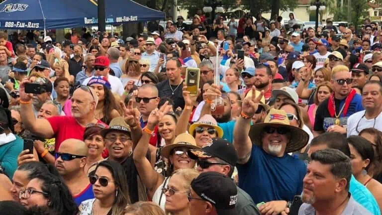 a large group of people enjoying live music at a festival