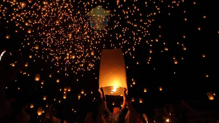 lanterns being launched in the night sky