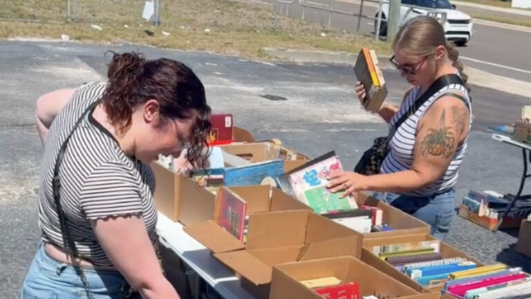 People looking through an outdoor bookstore