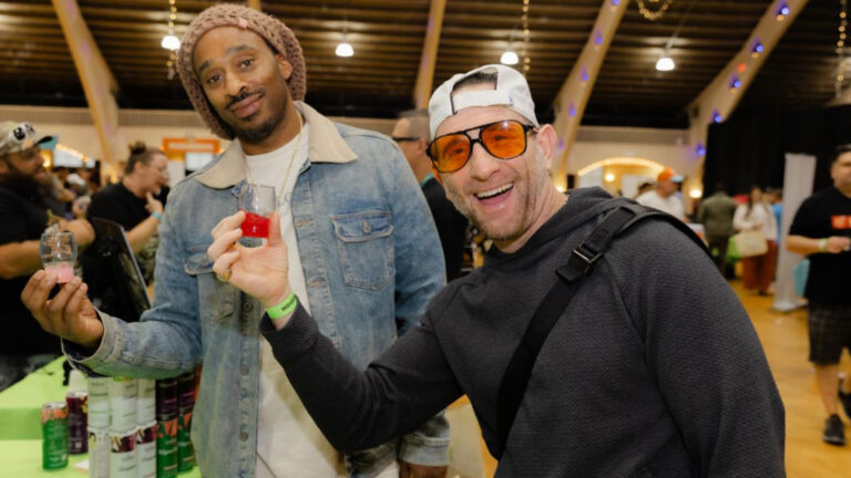 two guys holding up cups