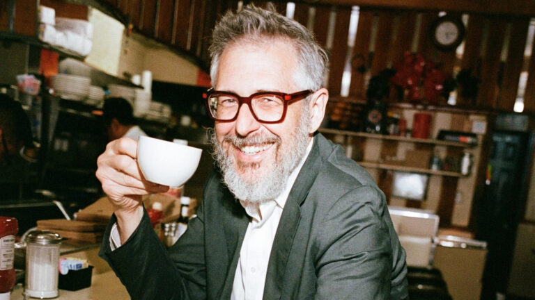 man holding coffee cup