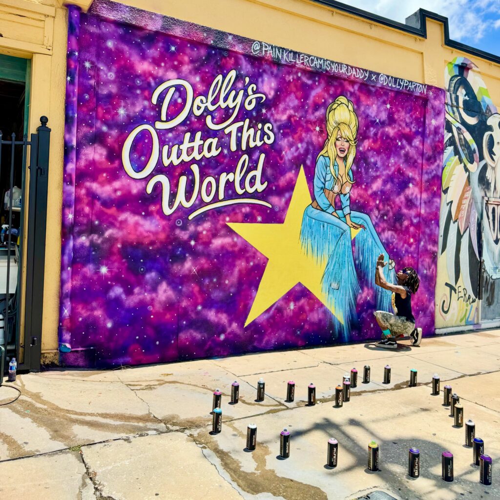 Painkiller Cam by his Dolly Parton mural in Tampa