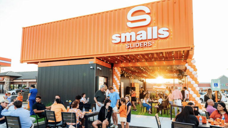 Exterior of restaurant made of orange shipping containers